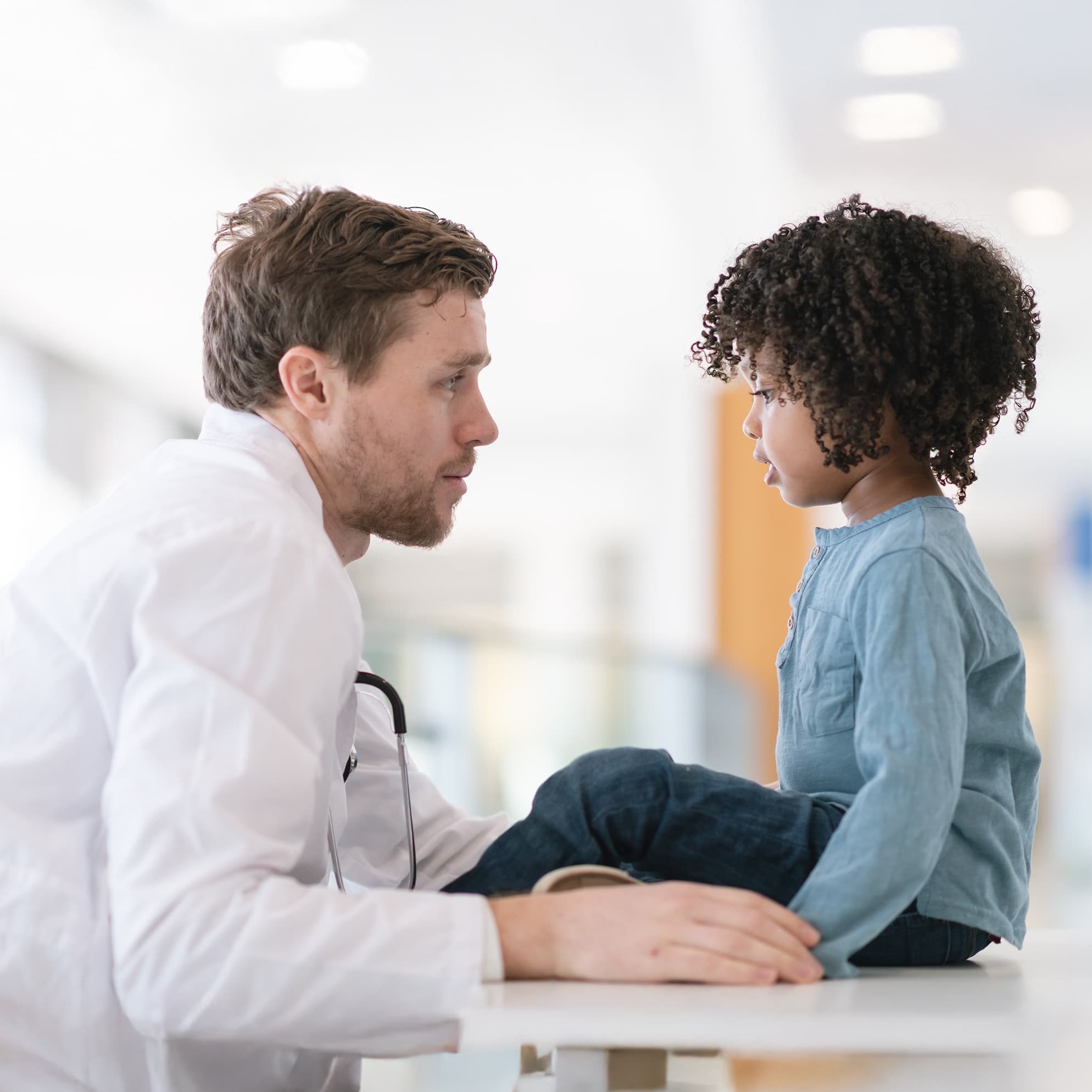 Provider talking to young patient.
