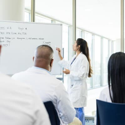 Children's Nebraska provider instructing a group of medical professionals.