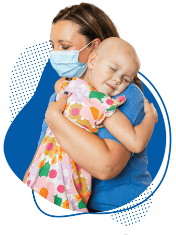 Children's provider hugging young cancer patient.
